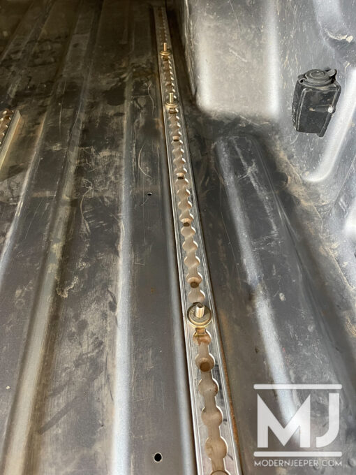 Mac's VersaTie Track mounted in bed of Jeep Gladiator